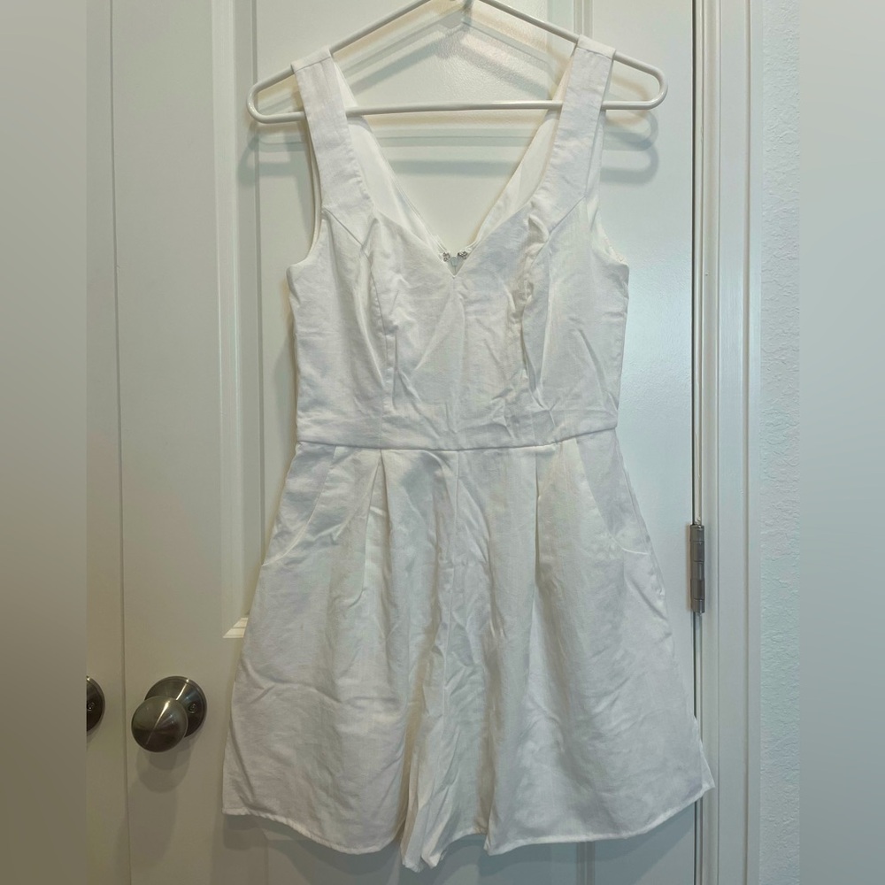Francesca’s white linen sweetheart neck romper